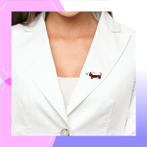 Dachshund Sterling Silver plated Brooch with Enamels in festive reindeer costume presented by a model in a white jacket