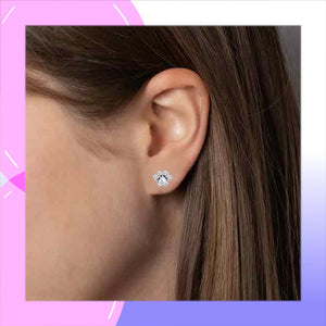 Cat & Paw Sterling Silver with Cubic Zirconia Asymmetrical Earrings modelling the cats paw