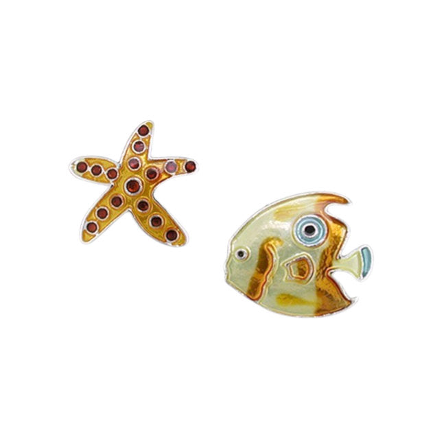 A pair of fish-shaped stud earrings on a plain white background. One earring is a gold starfish with small red gemstone accents, and the other is a yellow and gold fish with blue and white details.