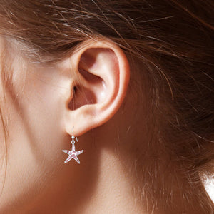 Starfish Sterling Silver hook Earrings with Pink Mother of Pearl modelled