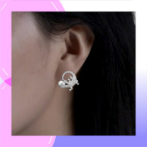 Crocodile Sterling Silver and Freshwater Pearl stud Earrings modelled