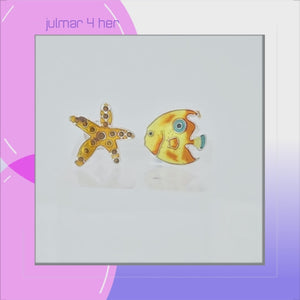 A pair of fish-shaped stud earrings on a plain white background. One earring is a gold starfish with small red gemstone accents, and the other is a yellow and gold fish with blue and white details viewed in 3d rotation