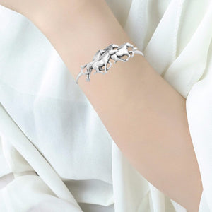 Horses on the Move Sterling Silver Bangle with Oxidised Accents shown modelled